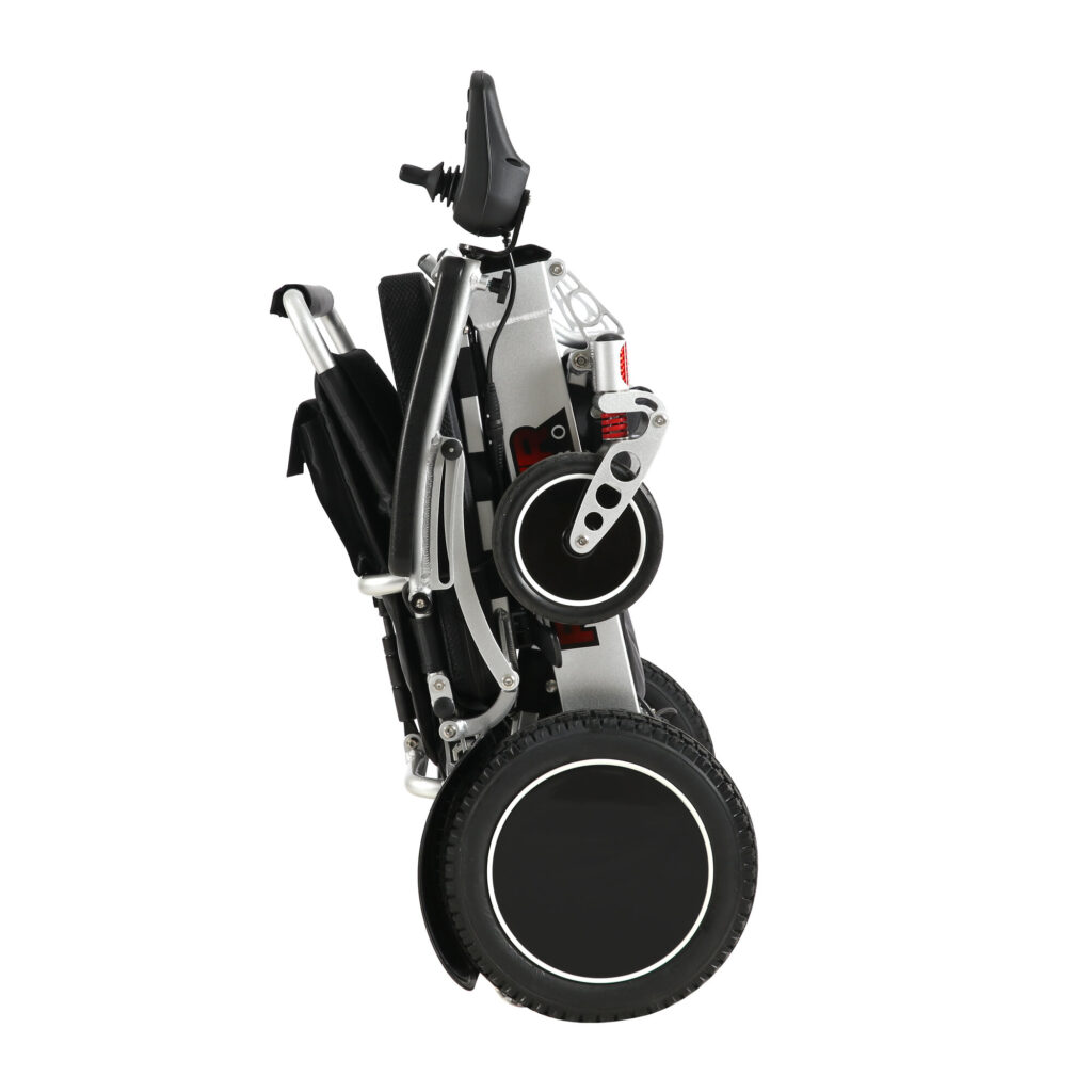 Ranger Maestro reclining folding power wheelchair folded and standing upright on its wheels, side view